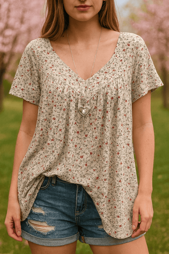Light beige floral print short sleeve blouse with a V neck and shorts