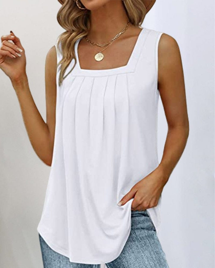 Front view of a woman wearing a white sleeveless square neck tank top with vertical pleats and a rounded hem