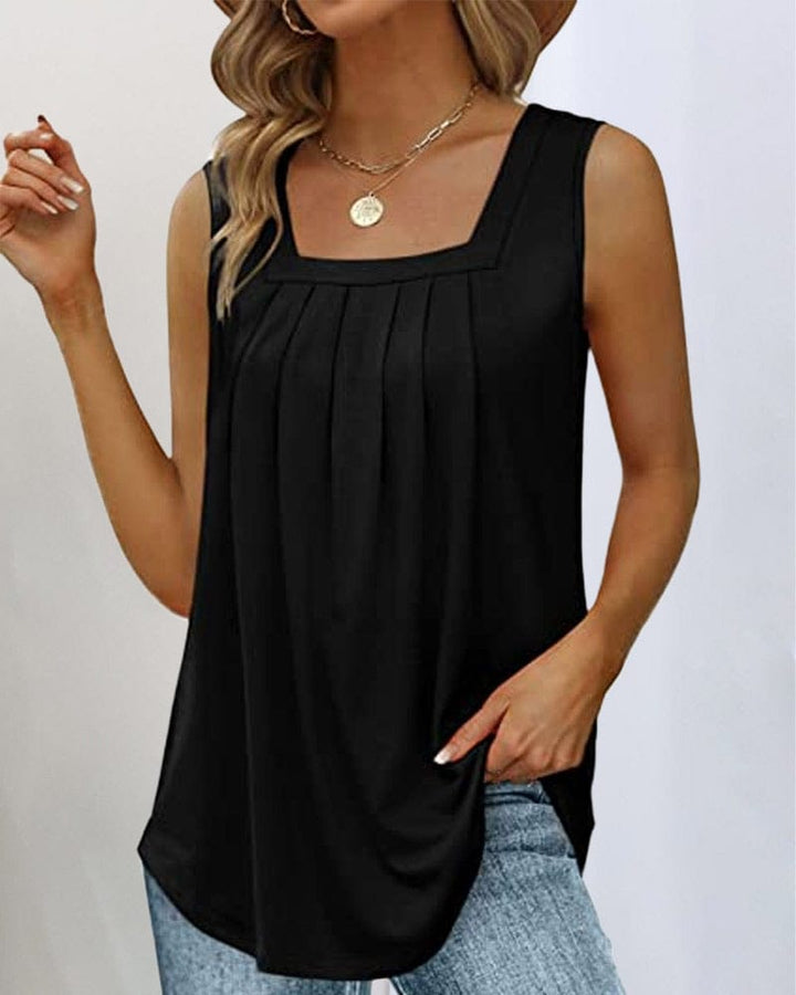Front view of a woman wearing a black sleeveless square neck tank top with vertical pleats and a rounded hem