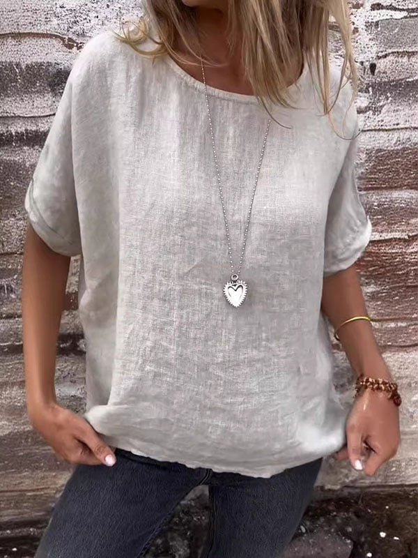 Front view worn by model of a light grey minimalist relaxed top in cotton linen blend