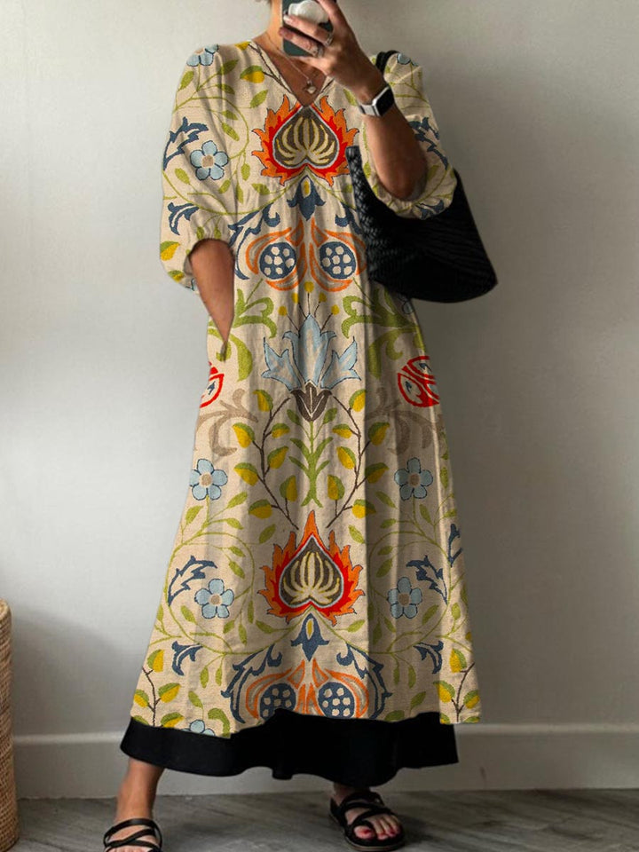 Front view of a model wearing the vintage floral cotton dress with pockets and a black handbag