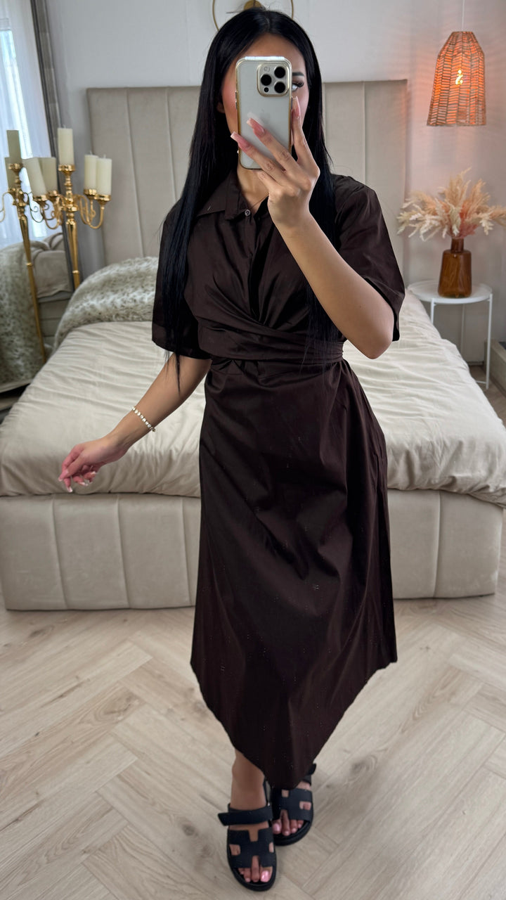 Front view, worn by model, a brown cross tie belt blouse dress in soft cotton blend with a phone covering, alternate angle