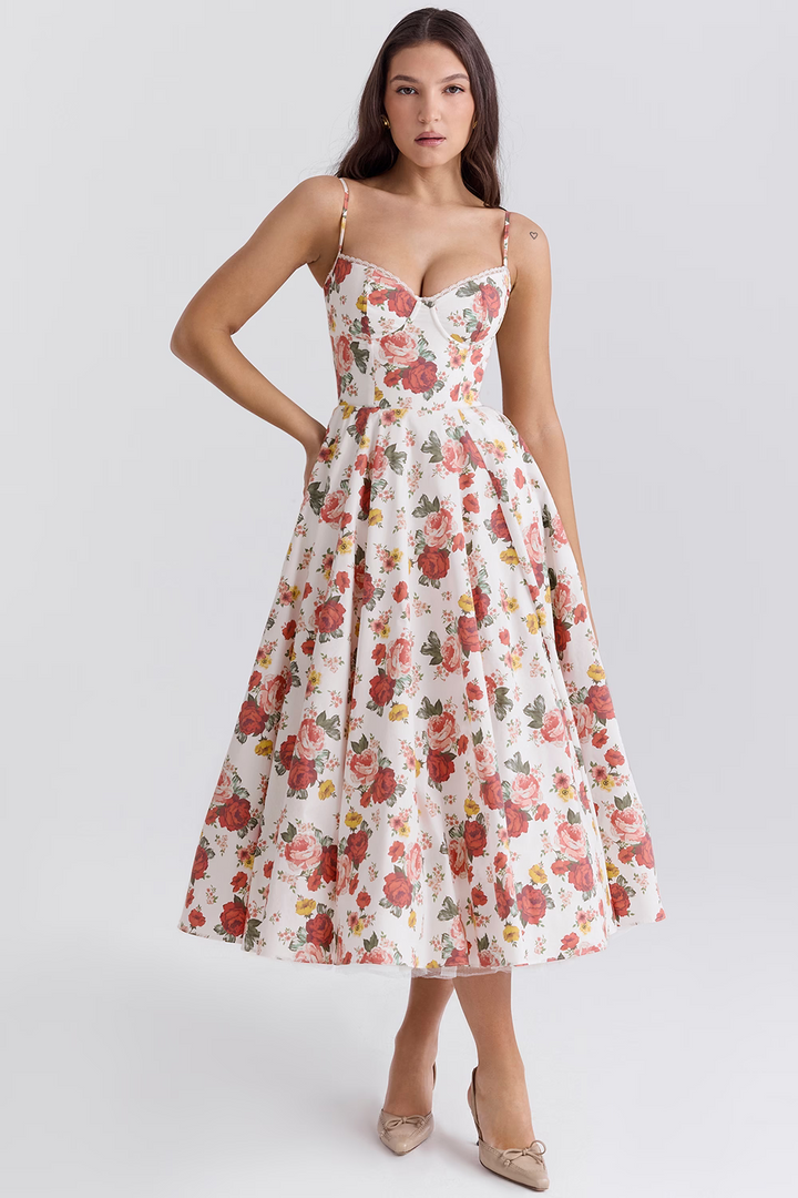 Front view worn by model, a floral satin corset dress with a structured bodice and a full midi skirt