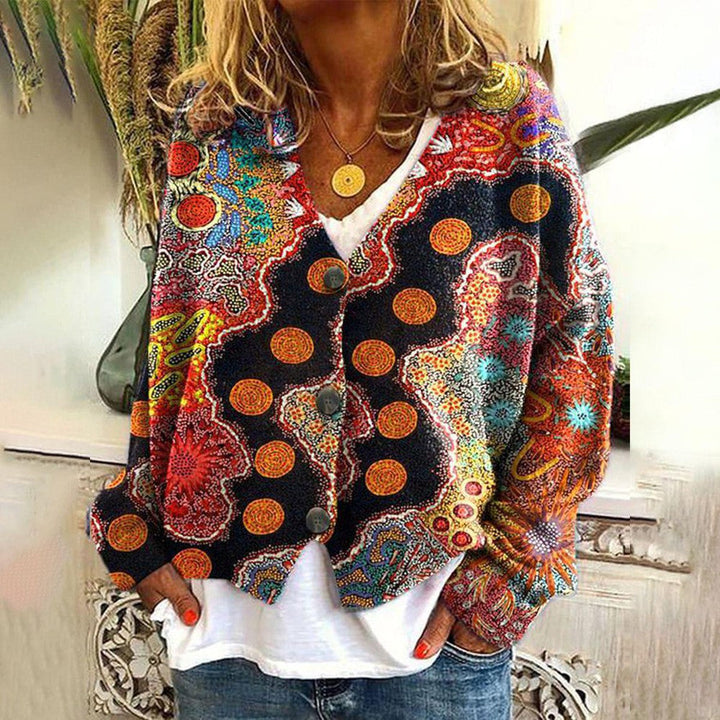 Black multicoloured cable knit boho jumper with large buttons over a white top