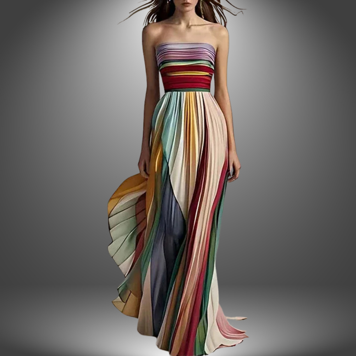 Front view of a model wearing the Mila maxi dress with colourful vertical pleats and a strapless bodice