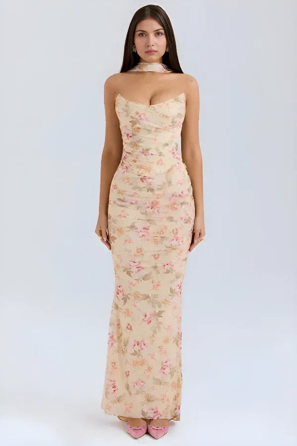 Front view worn by model, a floral maxi dress with a sweetheart neckline, ruched bodice and sheer neck scarf