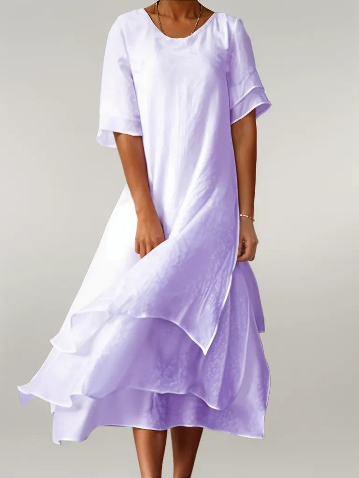 Oriana Cotton Maxi Dress in light purple, worn by a model, showing layered skirt and flowy fabric movement