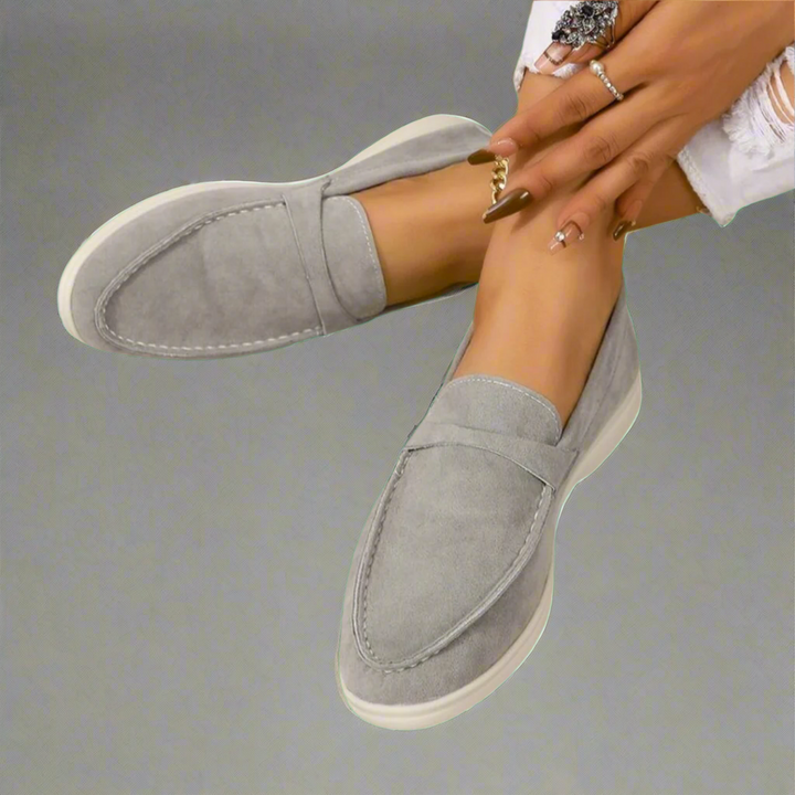 Ellis Elegant Flat Shoes in light grey suede with white soles, worn by model