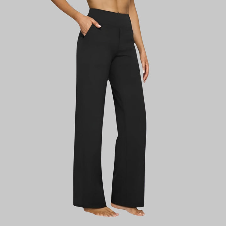 Beverly comfortable stretch pants, three quarter front view worn by model, hand in pocket, wide leg design