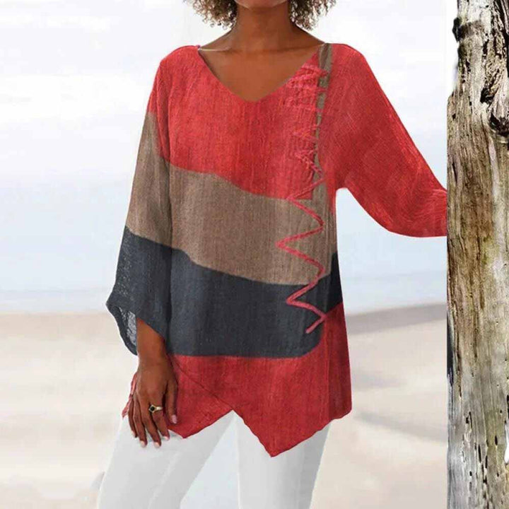 Front view of a model wearing the elegant tricolour shirt with red, brown, and dark grey colour blocks and zigzag stitching