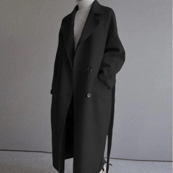 Front view of a black Florence premium blend wool coat, worn open over a white turtleneck