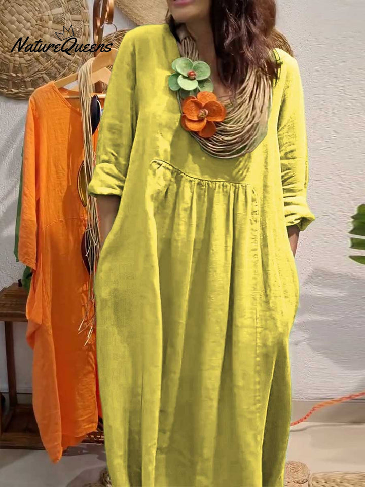 Lime green V neck cotton linen dress with three quarter sleeves, close up