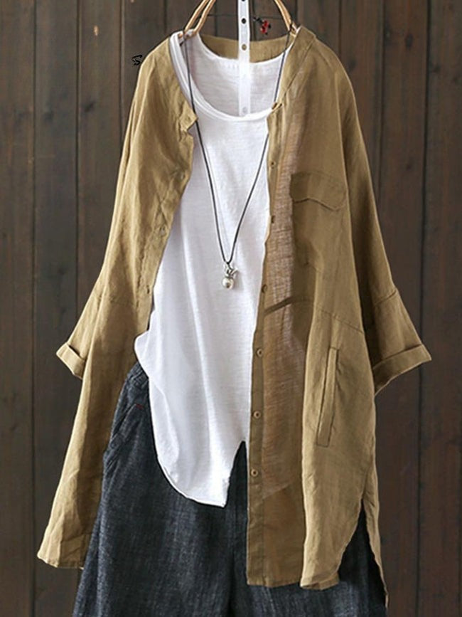 Khaki brown loose casual top jacket over a white top and dark trousers