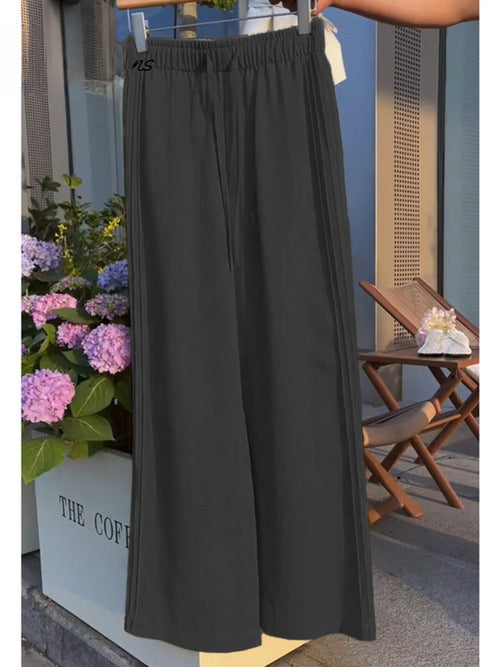 Front view of dark grey Tencel linen wide leg casual pants with an elasticated waist and drawstring