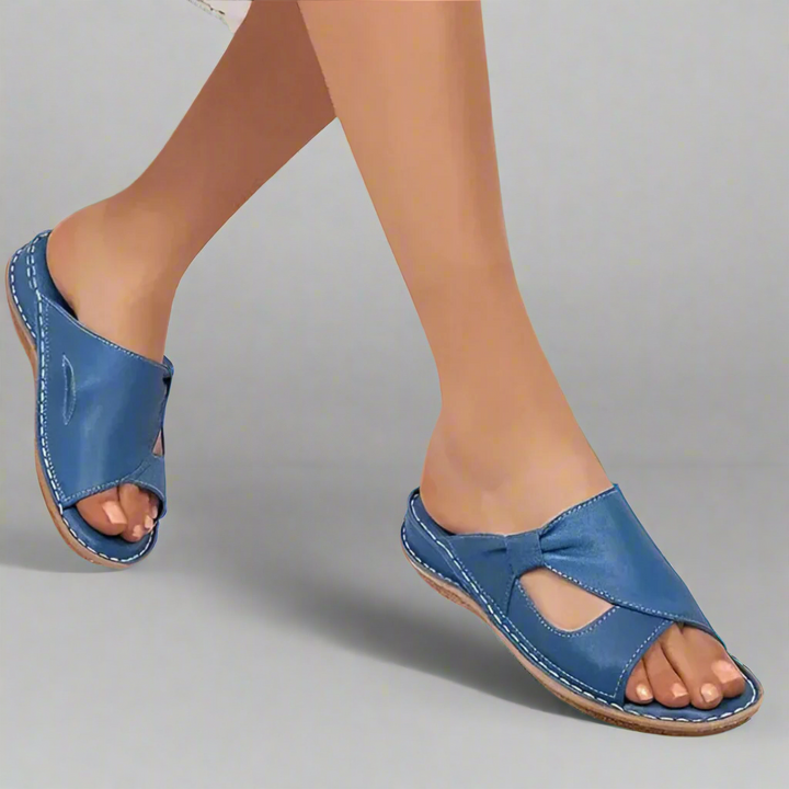 Vera premium leather arch support sandals, worn by model, showing the front and side view of the left foot