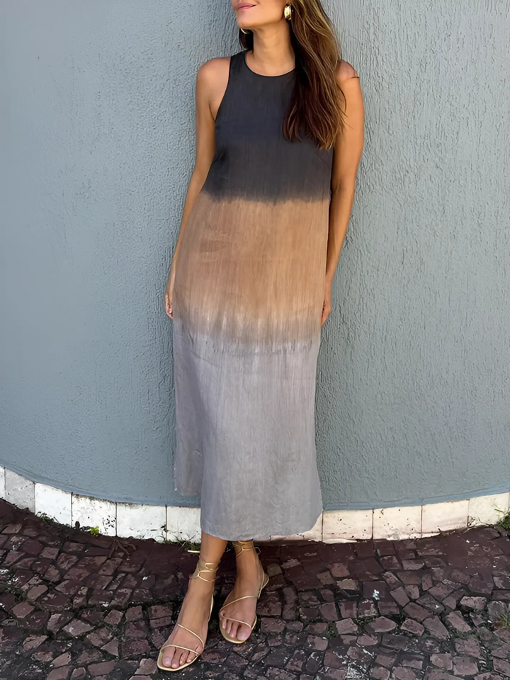 Willa Printed Dress worn by model, a sleeveless midi dress with a dark brown to light brown ombre print and sandals