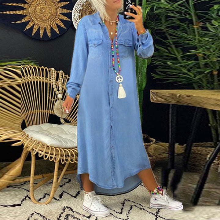 Front view of a model wearing a long sleeve denim maxi dress with a square neckline and colourful accessories