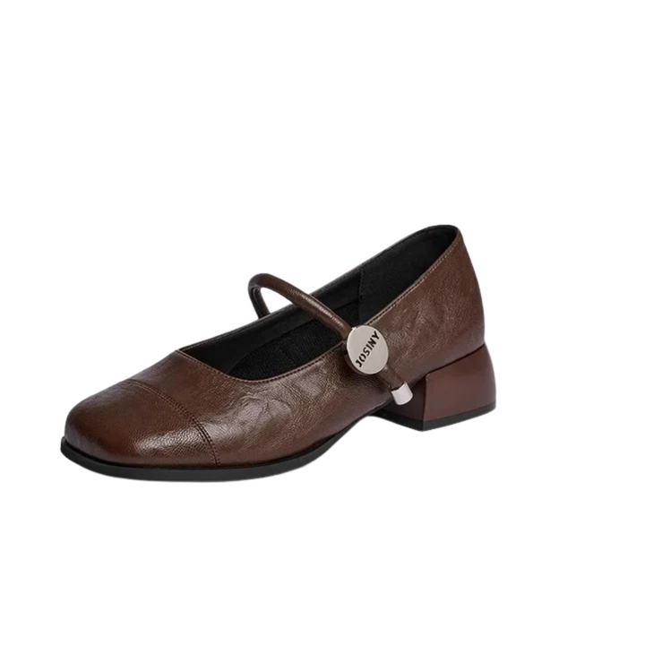 Side view, a single brown square toe Mary Jane shoe with a silver buckle and strap