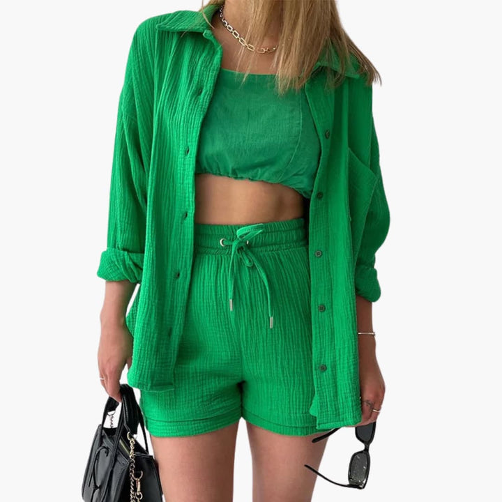 Brianna elegant summer two piece suit, front view worn by model, with black bag and sunglasses, close up