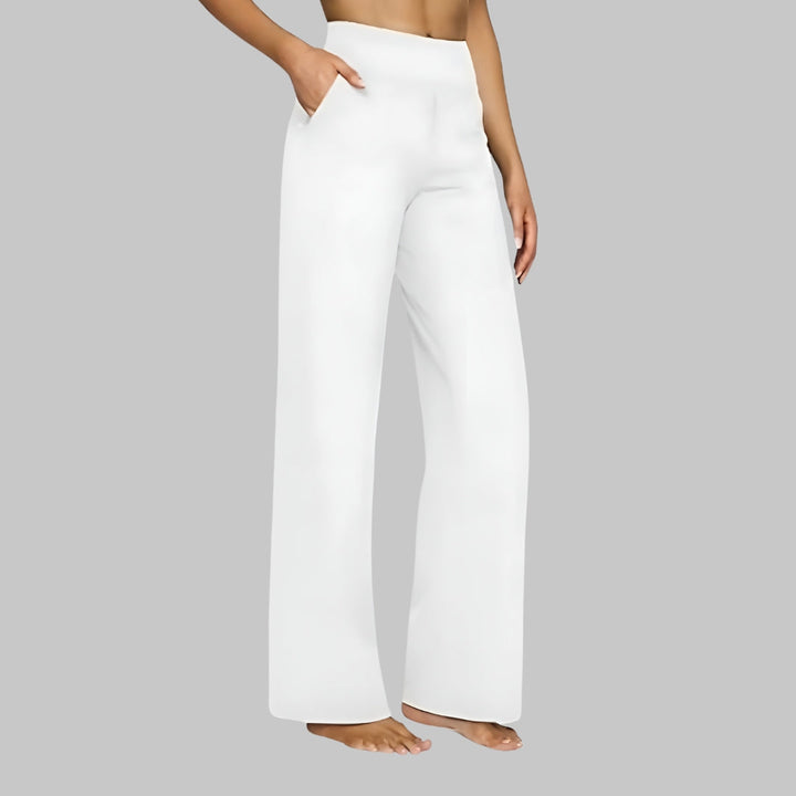 Beverly comfortable stretch pants, side view worn by model, hand in pocket, wide leg design, bare feet