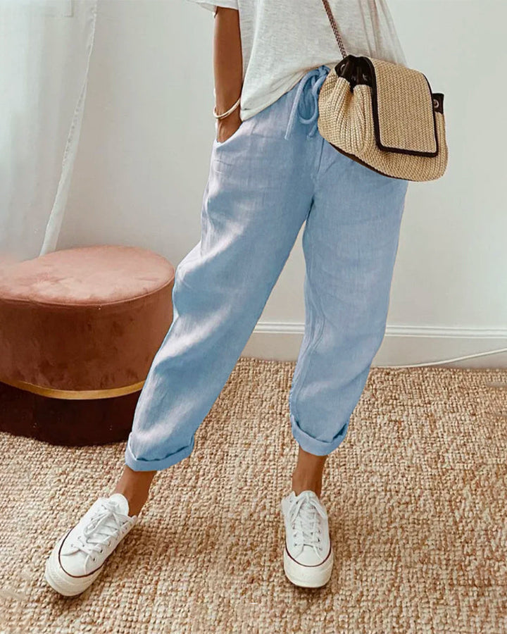 Carter Sweat-Wicking Linen Pants, front view worn by model, with rolled cuffs and a drawstring waist