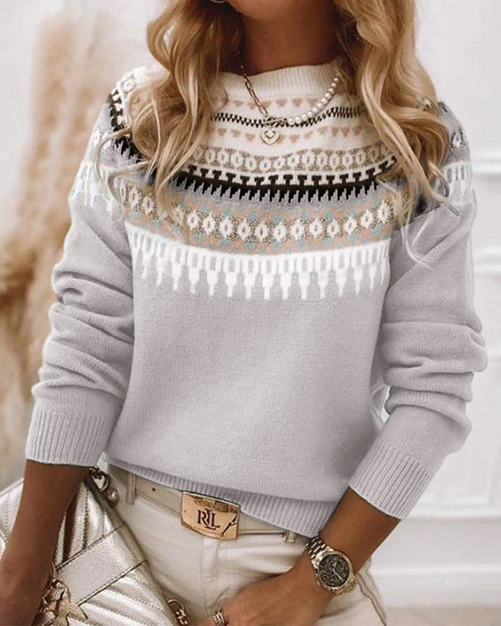 Nordic Fair Isle knit sweater worn by model, close up of patterned yoke and light grey pullover