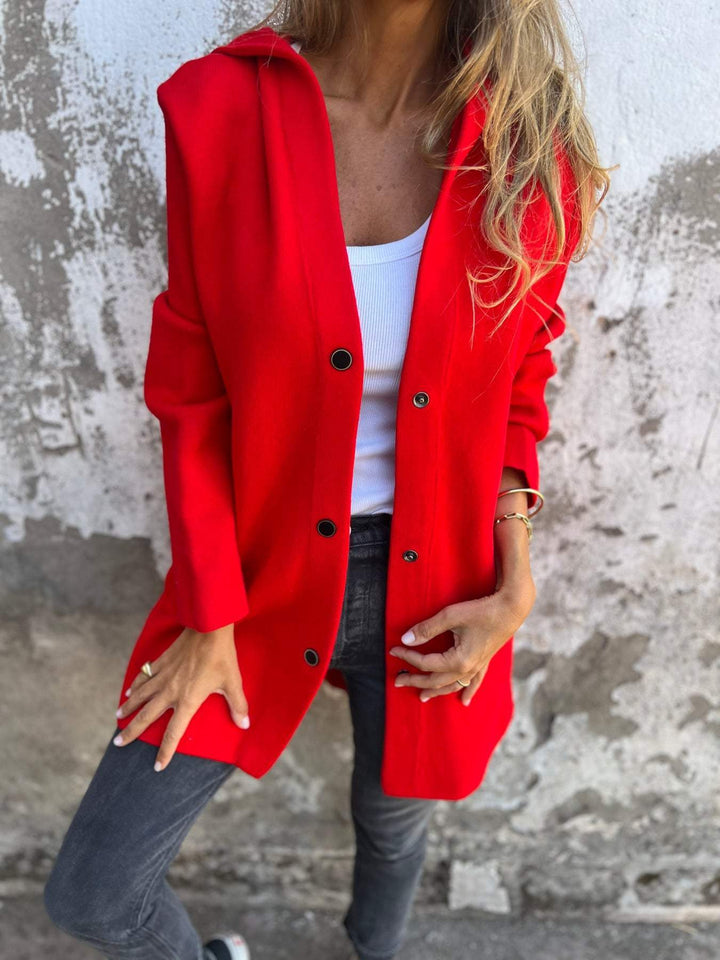 Bright red hooded casual jacket partly open with black buttons, front view