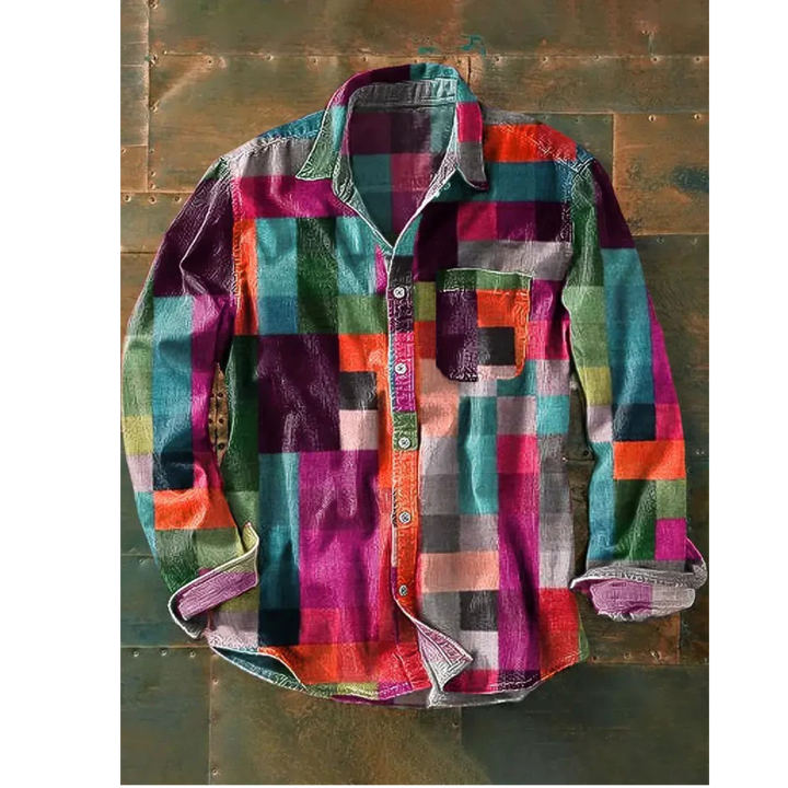Close up of the unisex vintage shirt with its colourful rainbow print and rolled up cuffs