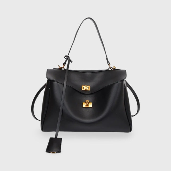 Front view of the Ciara vegan leather shoulder bag in black with gold hardware and a long key fob