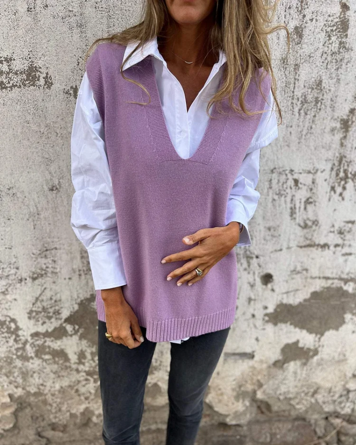 Front view of a model wearing a lavender V-neck cozy knit cardigan over a white shirt and dark jeans
