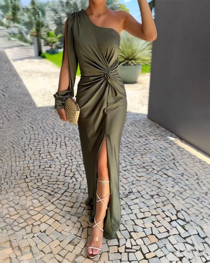 Front view of a model wearing an olive green single shoulder flowing elegant maxi dress with a thigh high split