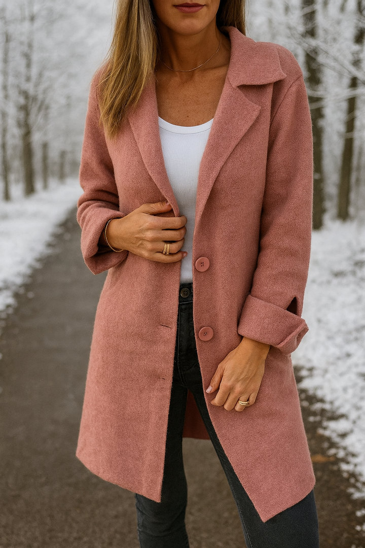 Dusty pink mid season jacket worn unbuttoned over a white top