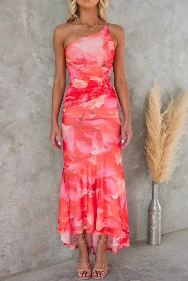 Front view of a model wearing an elegant summer floral maxi dress with a one shoulder design and ruched bodice