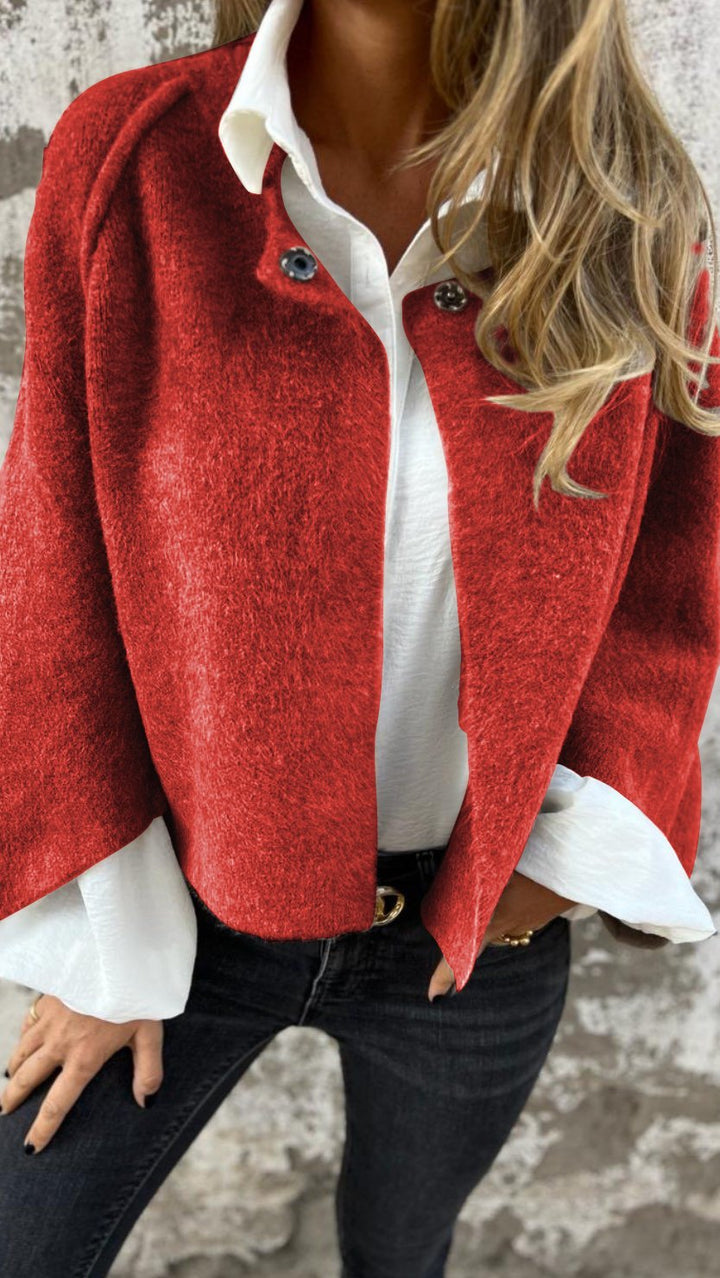 Red wool coat over a white shirt, close up of the buttons