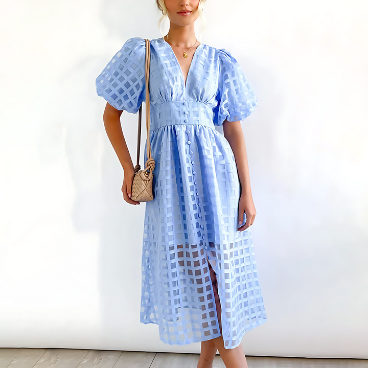 Front view of an elegant blue summer midi dress with a square pattern and button details worn by a model