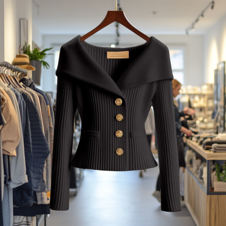 Front view of the black Priscilla Cardigan in premium knit on a hanger, showcasing the ribbed texture and gold buttons