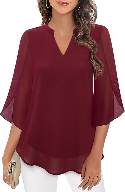 Front view of a burgundy V-neck chiffon blouse, worn by model, with flowy 3/4 sleeves and a curved hem