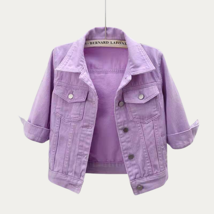 Front view of a purple colourful denim jacket with rolled up three quarter sleeves, on a hanger