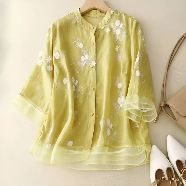 Lime green lightweight cotton blouse with white floral embroidery and sheer sleeves