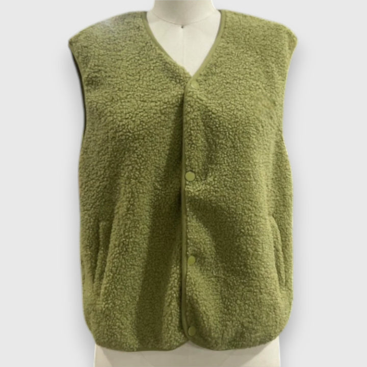 Front view, green cosy fleece vest on a mannequin, showing button detail and pockets