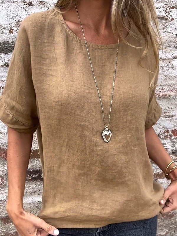 Close up worn by model of a brown cotton linen blend minimalist relaxed top with a heart necklace