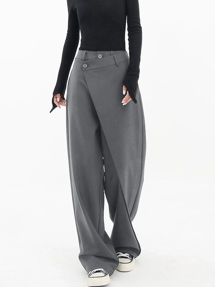 Front view, avant-garde tailored pants with a unique wrap waist, baggy fit, and visible buttons on the waistband