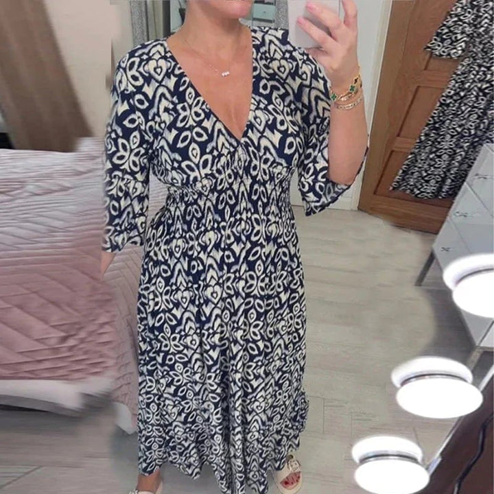 Printed Dress worn by model, front view, navy and white pattern, V-neck, wide sleeves, summer style