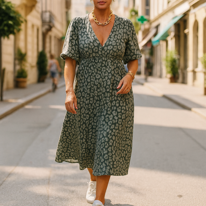 Front view of a model wearing a green leopard print V-neck summer maxi dress with puffed sleeves