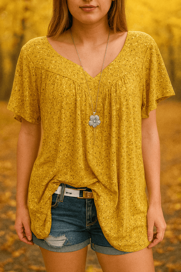 Mustard yellow floral print short sleeve blouse with a V neck and shorts