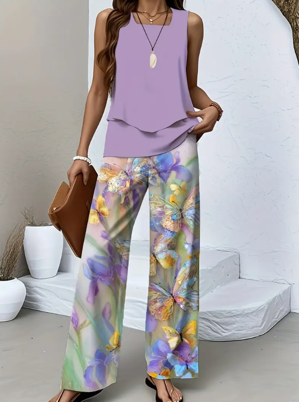 Front view, model wearing a lavender square collar top with butterfly print wide leg pants set
