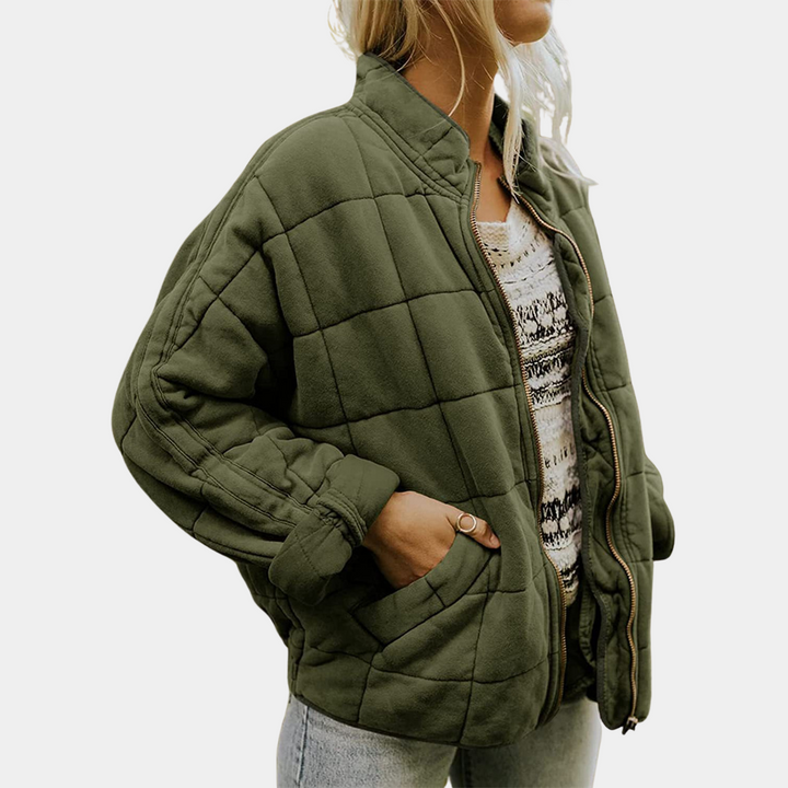 Front view of the elegant blazer, worn by model, showing the premium soft tailored jacket with a hand in the pocket