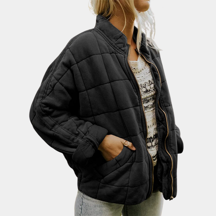 Side view of the premium soft tailored jacket, worn by model, showing the elegant blazer unzipped