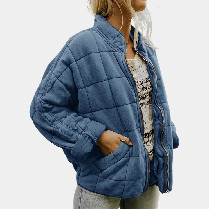 Three quarter view of the premium soft tailored jacket, worn by model, showing the elegant blazer unzipped