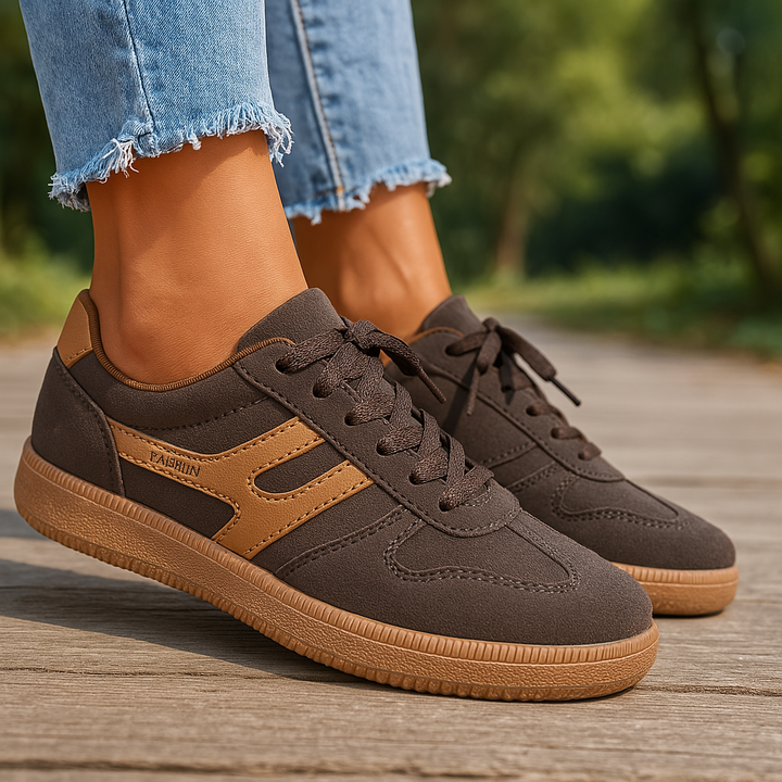 Ulani orthopedic comfort shoes worn by model, close up of brown and tan sneakers with gum sole and frayed jeans